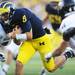Michigan quarterback Russell Bellomy carries the ball in the fourth quarter at Michigan Stadium on Saturday. Melanie Maxwell I AnnArbor.com